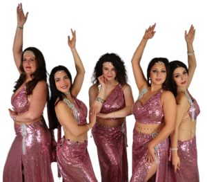5 belly dancers posing in sparkly pink outfits.
